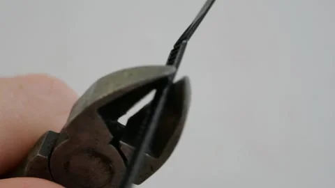 Compact Wire Cutter Cutting Black Nylon Cable with Sharp Loud Snap Showing Stock Footage 321528916