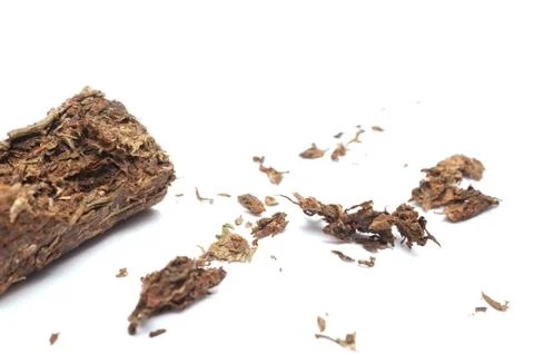 Compacted dried marijuana isolated over white background. Stock Photos