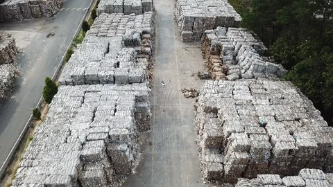 Compacted recyclable plastic waste at a recycling plant. aerial view Stock Footage 97150588