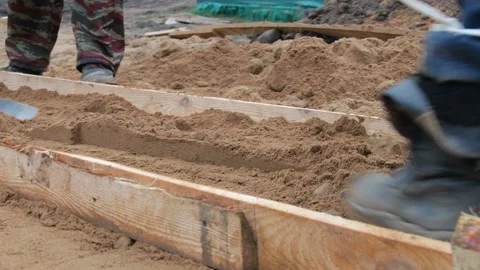 Compaction and compaction of sand for concrete floor on the ground Stock-Footage 98281712