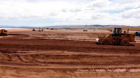 Compaction process of platforms with a crowbar-type roller for the construc.. Stock Photos