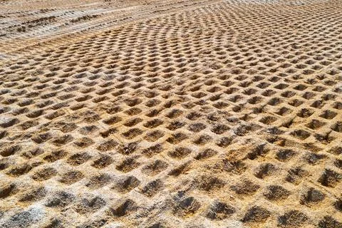 Compaction of soil at the construction site, compaction of soil before constr Stock Photos