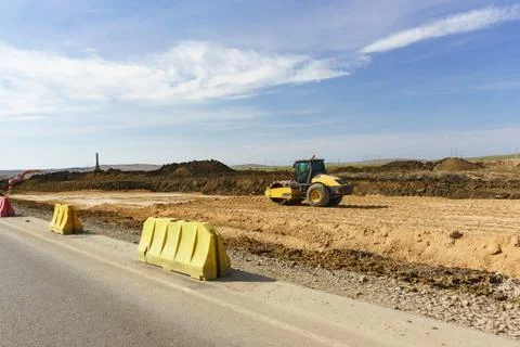Compaction of the soil vibration roller during the construction of the Expres Stock Photos