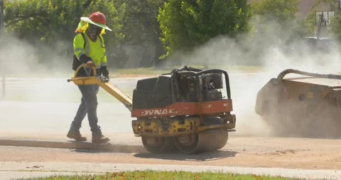 Compactor and Skid Steer Loader Stock Footage 138788769