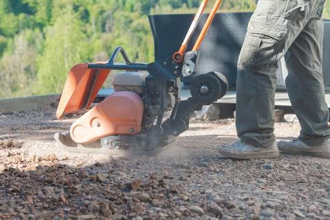 Compactor creating dust cloud Stock Photos