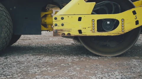 Compactor is driving over and compresses ground Vidéo 195695028