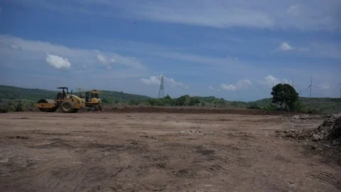 Compactor flatens the ground Stock Footage 233197443