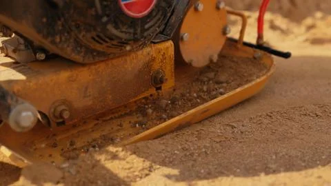 Compactor machine preparing foundation at construction site Stock-Fotos