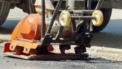 Compactor Plate Flattens Fresh Asphalt On A Construction Site Stock Footage 336363266