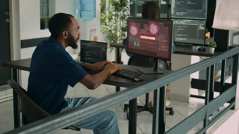 Company developer writing code encounters system failure Stock Photos