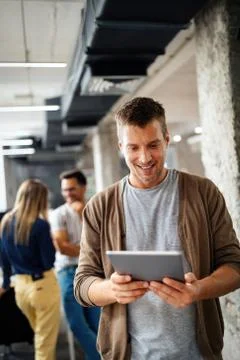 Company employees working in software development and designer office Stock Photos