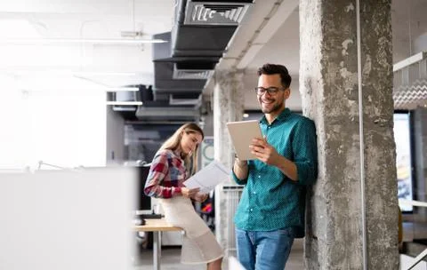 Company employees working in software development and designer office Stock Photos