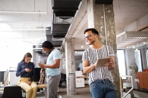 Company employees working in software development and designer office Stock Photos