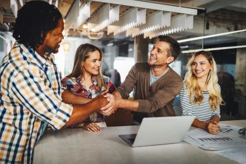Company employees working in software development and designer office Stock Photos