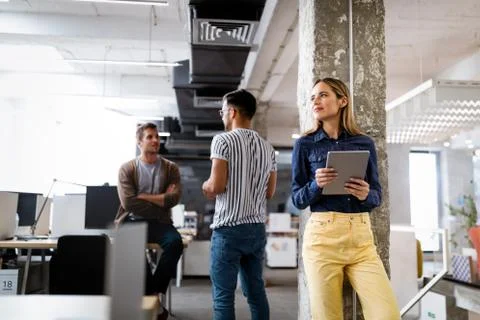 Company employees working in software development and designer office Stock Photos