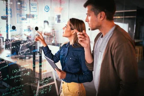 Company employees working in software development and designer office Stock Photos