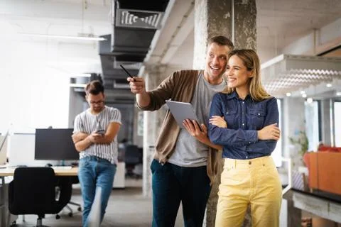 Company employees working in software development and designer office Stock Photos