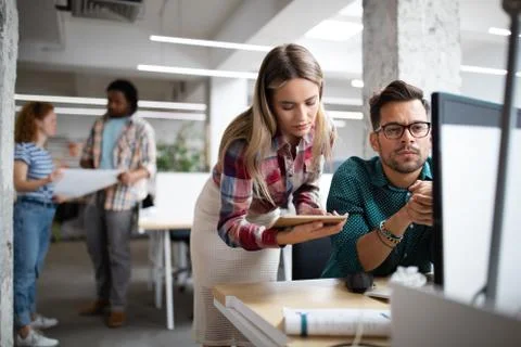 Company employees working in software development and designer office Stock Photos