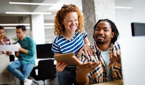 Company employees working in software development and designer office Stock Photos