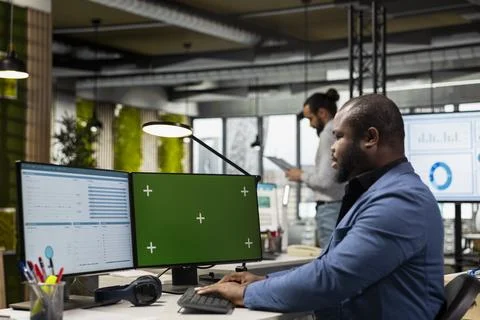 Company worker handling data analysis next to isolated display Foto stock