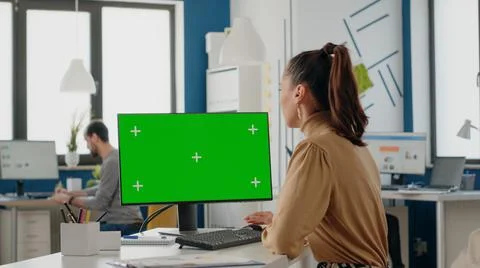 Company worker using computer with green screen Stock Photos