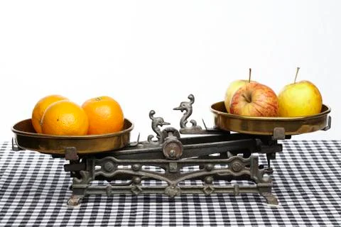 Compare apples to oranges Stock Photos