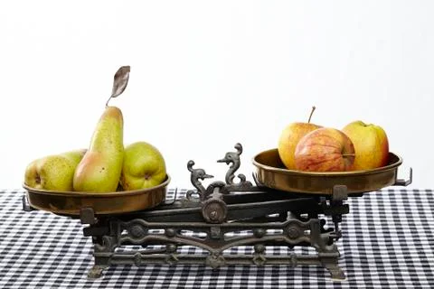 Compare apples to pears Stock Photos