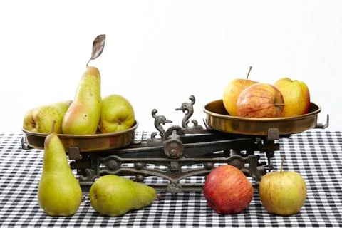 Compare apples to pears Stock Photos