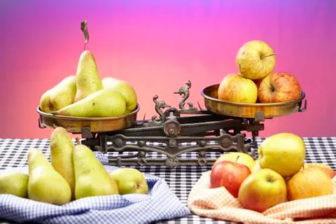 Compare apples to pears Stock Photos