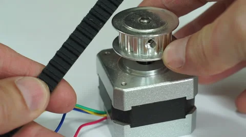 Comparing Cogged Belt Pulley Stepper Motor Macro Stock Footage 64199229