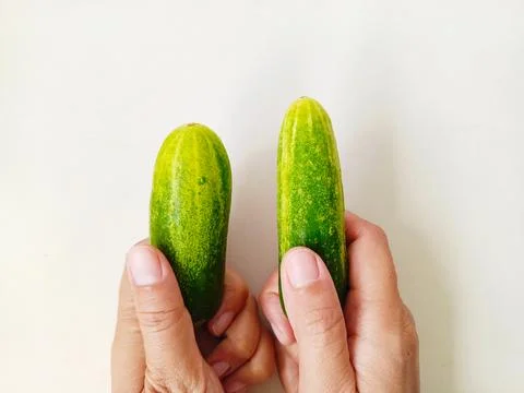 Comparing cucumbers Stock Photos