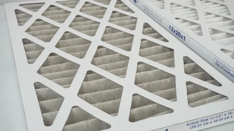 Comparing dusty old filter to a clean new one Stock Footage 98618444