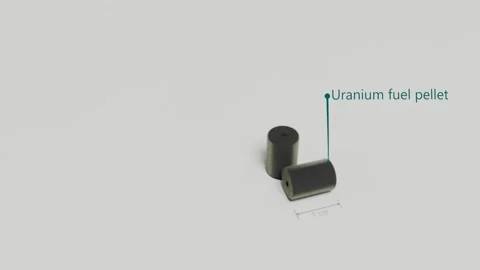 Comparing energy density, oil versus nuclear fuel pellet. Stock Footage 256976357