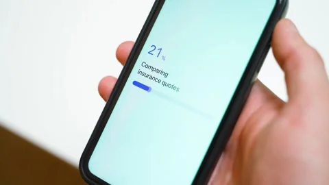 Comparing insurance quotes on smartphone with progress bar. Twelve quotes found Stock-Footage 342735432