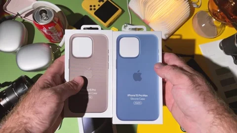 Comparing iPhone 15 Pro Max's Silicone and Controversial FineWoven Cases Stock Footage 251890008