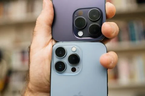 Comparing Latest Apple Computers and iPhones Stock Photos