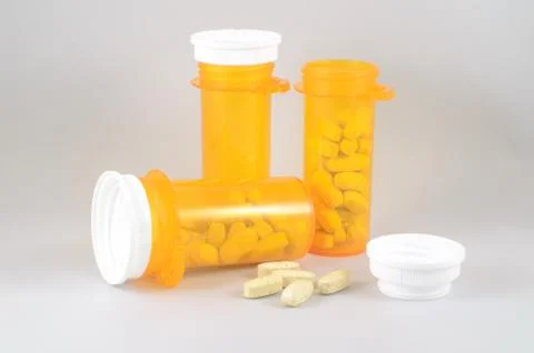 Comparing many pills of conventional or modern medicine versus one capsule Stock Photos