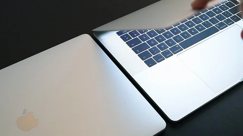 Comparing the new Apple Computers MacBook Pro 16 inch display Stock Footage 121287983
