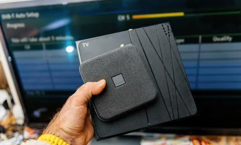 Comparing Orange TV Decoder Sizes Stock Photos