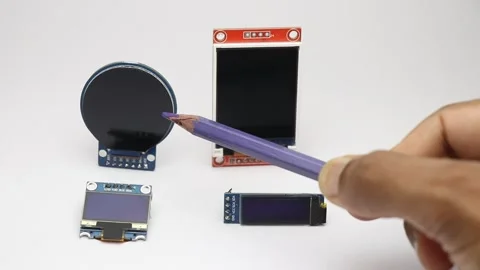 Comparing round lcd square lcd and oled display modules of different types Stock Footage 345885543