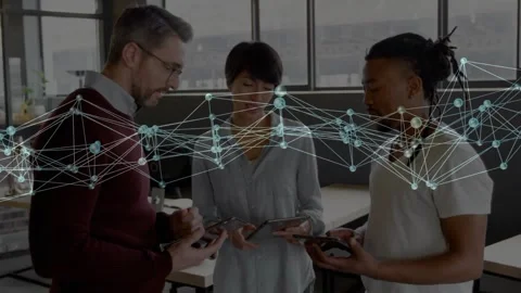 Comparing team viewing tablets and phone in office by windows in smart casual, Stock Footage 330577915