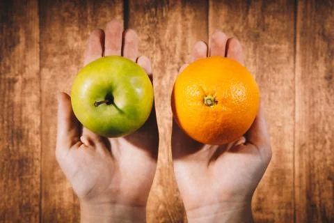 Comparison of apples with oranges. Stock Photos