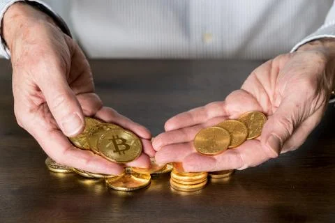 Comparison between gold and bitcoin as an investment Stock Photos