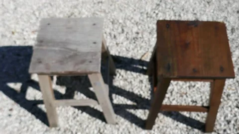 Comparison between two wooden stools. One old and ruined, the other treated a Stock Footage 149841847