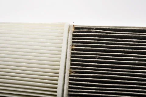 Comparison of a ditry and clean cabin filter in the car Stock Photos