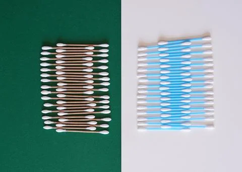 A comparison of eco-friendly and plastic cotton buds flat lay Stock Photos