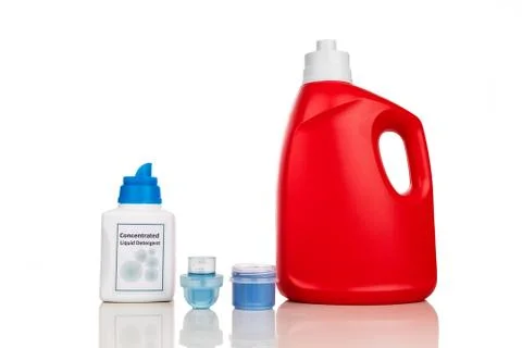 Comparison of regular and concentrated laundry liquid detergent against white Stock Photos