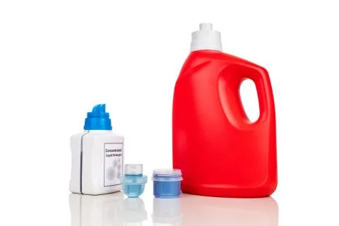 Comparison of regular and concentrated laundry liquid detergent against white Stock Photos