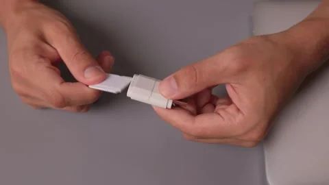 Comparison of SD and MicroSD Cards in Different Hands and Their Various Uses and Stock Footage 313630385