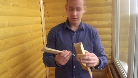 A comparison of the two wooden bars with your hands Stock Footage 75914401
